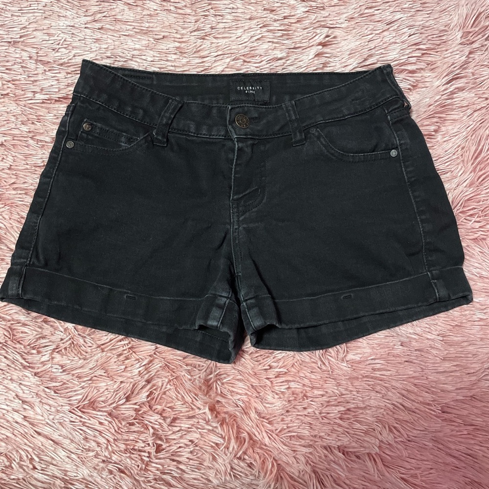 Washed out black jean shorts.